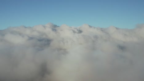 Aerial-view-above-clouds,-blue-and-white,-Hawaii