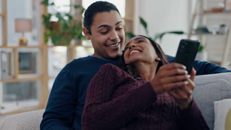 Couple,-phone-and-talking-on-a-home-sofa