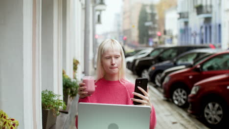 Blond-woman-videocalling-at-the-terrace