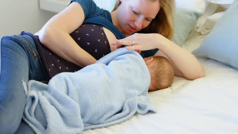 Mother-holding-and-breastfeeding-to-her-baby-4k