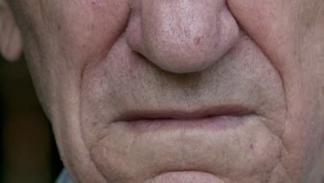 Face-nose-and-mouth-of-old-man,-close-up