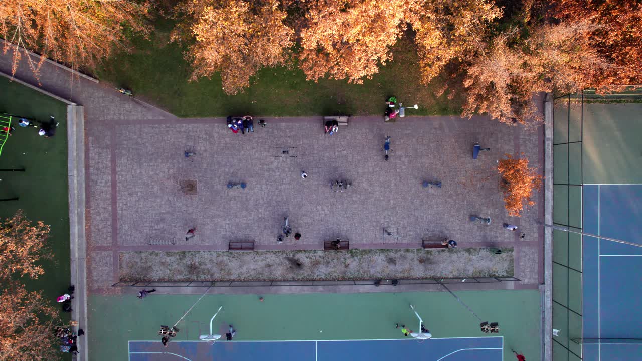 Overhead view of a group of people exercising in Parque Araucano, Las Condes, Santiago, Chile