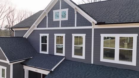 luxury custom craftsman style grey home exterior, aerial view video