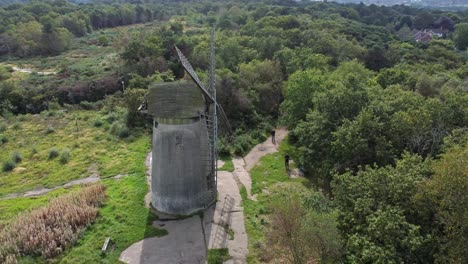 bidston hill disused rural flour mill restored traditional wooden sail windmill birkenhead aerial view slow left rotation