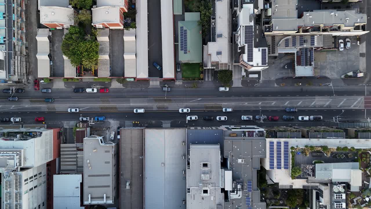 Aerial View of a City Street with Buildings and Cars