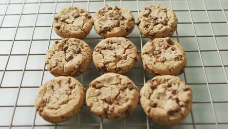 Video-of-rows-biscuits-on-a-baking-rack-over-white-background