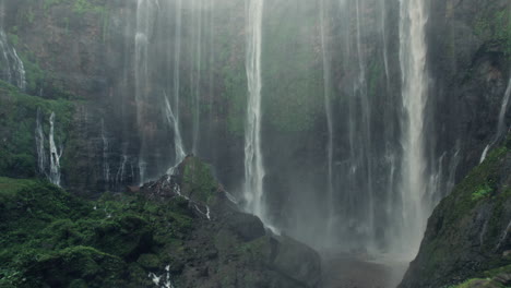 close-up of tumpak sewu waterfall's powerful cascades in east java, indonesia