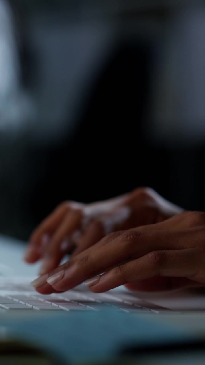 Close-up of Person Typing on a Wireless Keyboard