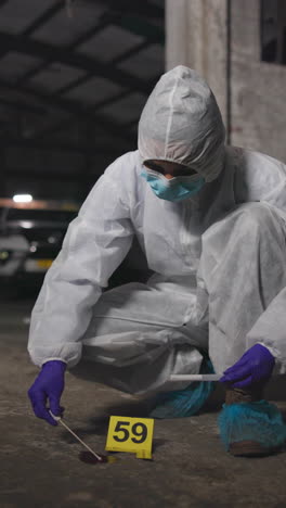 a crime scene investigator collects evidence at a crime scene