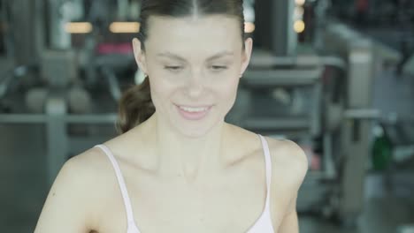 woman exercising on treadmill at the gym