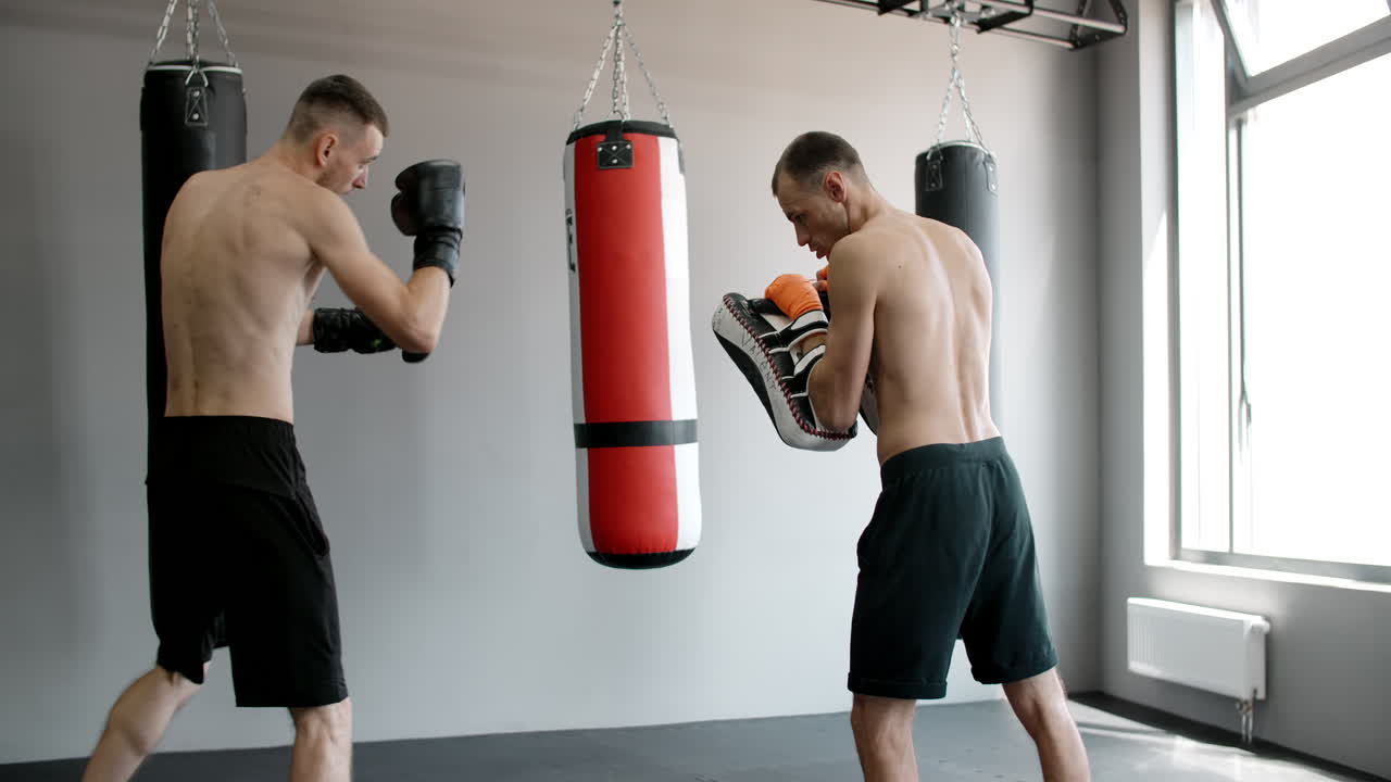 Men practicing Muay Thai Kickboxing