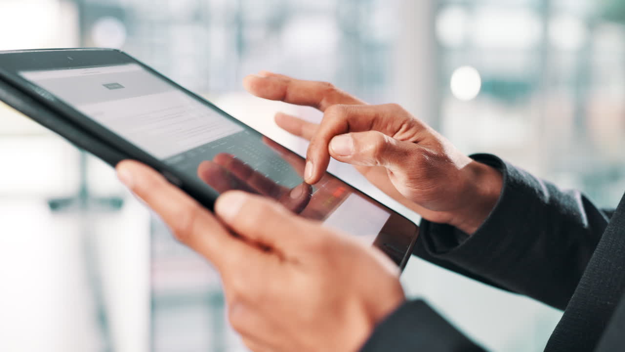 Hands using a tablet