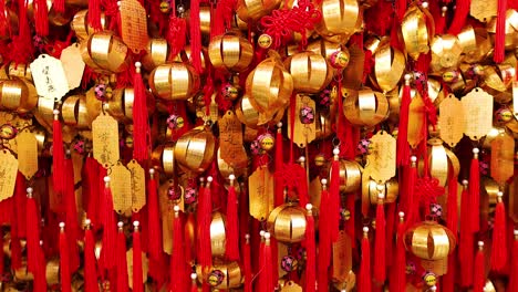 vibrant display of golden bells and red ribbons