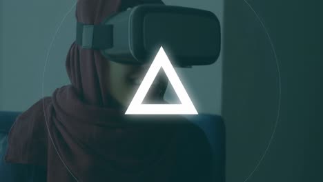 animation of circles and triangles pulsating over woman wearing vr headset