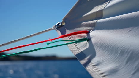 close-up of sailboat sail and ropes on a sunny day