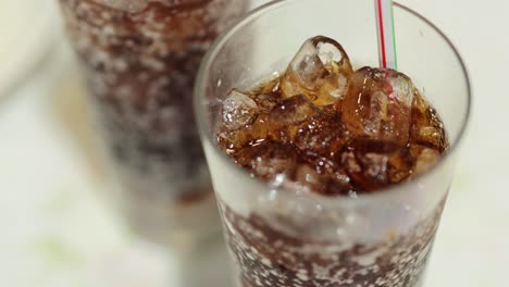 refreshing soda with ice in a glass