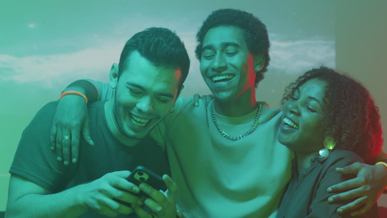 Friends looking at the photo and making a new one