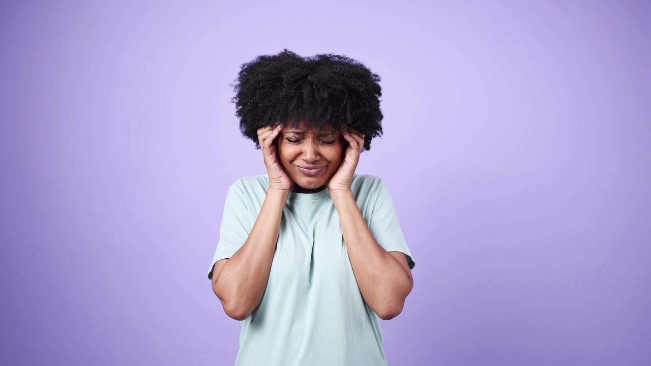 Young African American Woman Suffering from Headache and Toothache