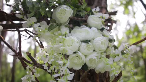 rustic white floral arch in forest