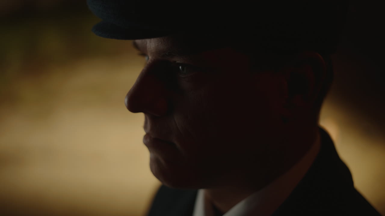 Dark portrait of a man in a hat