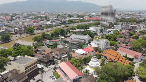 aerial view of white ancient pagoda at wat ket karam near ping river in chiang mai, thailand.