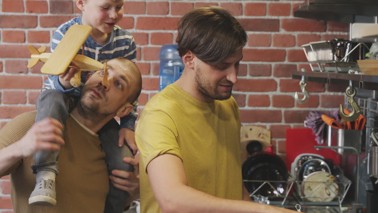 Cheerful Same-Sex Family with Son in Kitchen