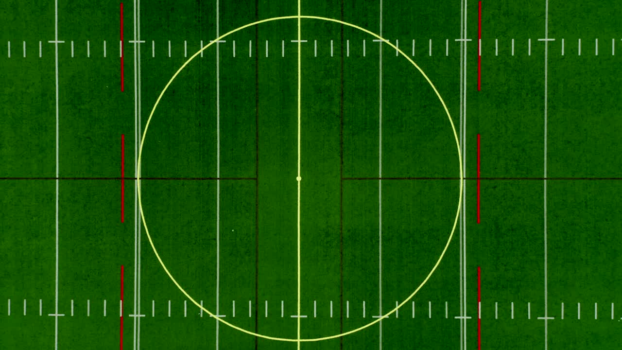 Drone flying from a field center point and moving up until in the clouds and we see the whole pitch