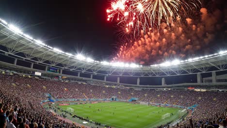 soccer match with fireworks at night