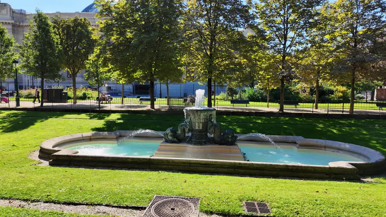 Water fountain park in Paris France, green space near Champs-Élysées avenue