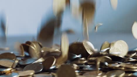 closeup slow motion dropping coins