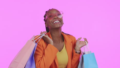 Black-woman,-shopping-bag-and-studio-with-excited