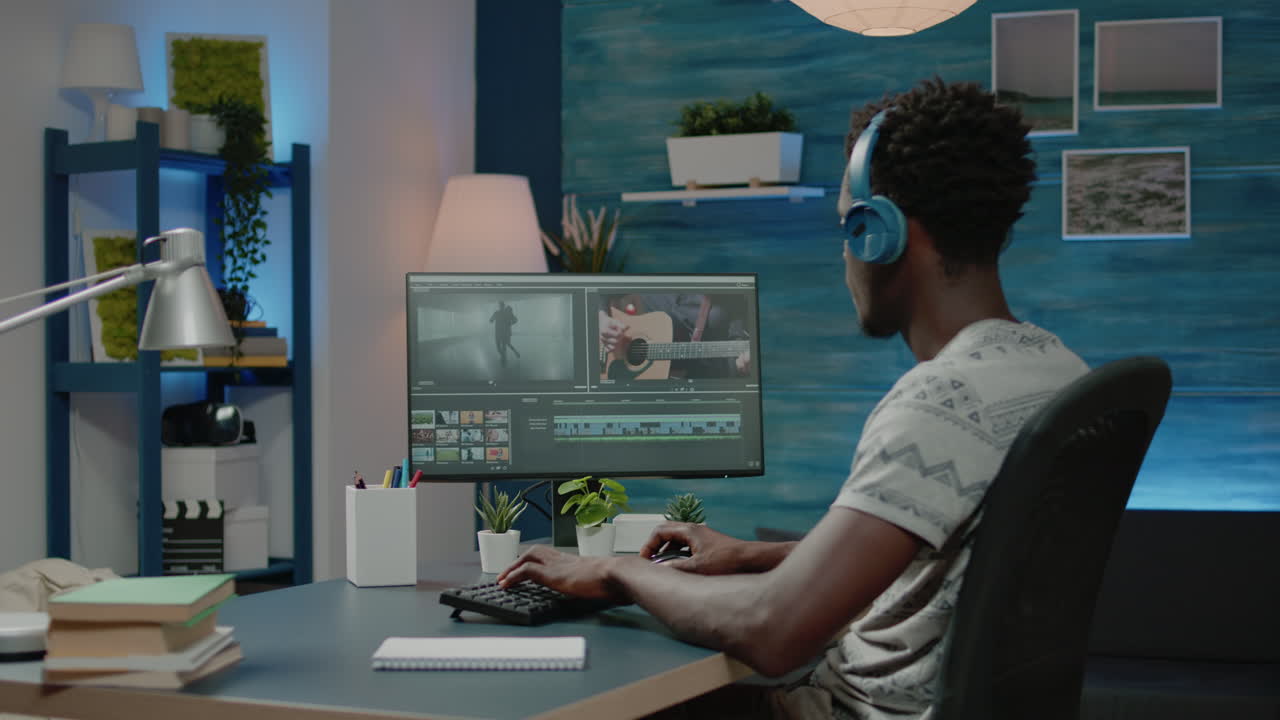 Videographer working with audio and visual effects for montage