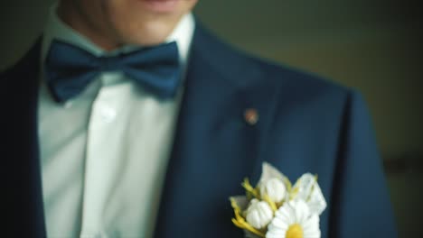 groom getting ready in tuxedo