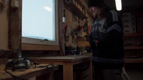 a man wiping the surface of the table in indre fosen, trondelag county, norway - static shot