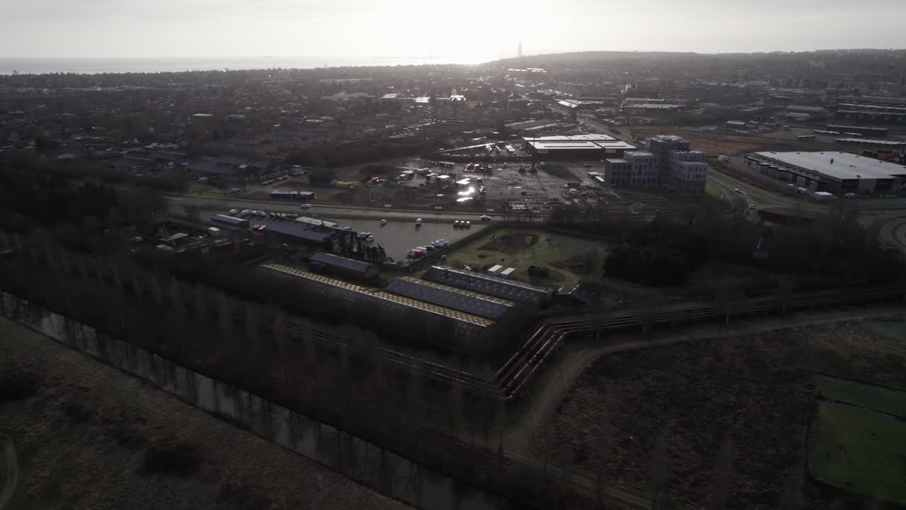 Aerial Overview of City and Industrial Area - Tilt Up Shot and Dolly In Shot