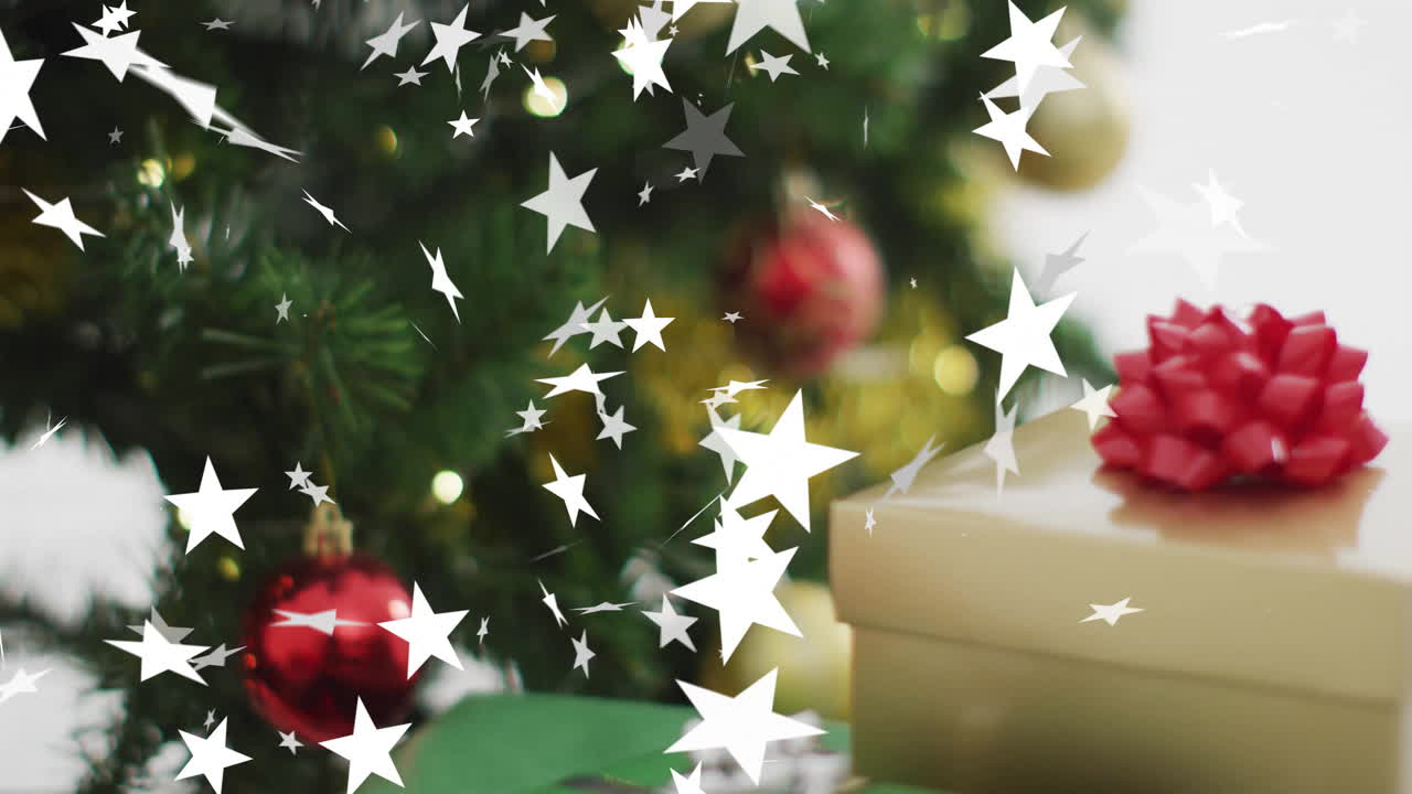 Animation of stars falling over christmas decorations and gift background