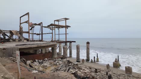 gimbal wide panning show of a beachfront home that burned in the palisades fire in malibu, california. 4k