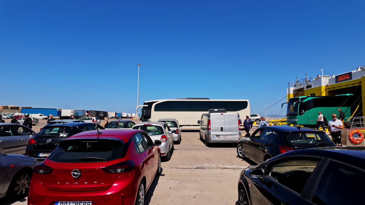 Cars and a bus waiting to board a ferry at the port