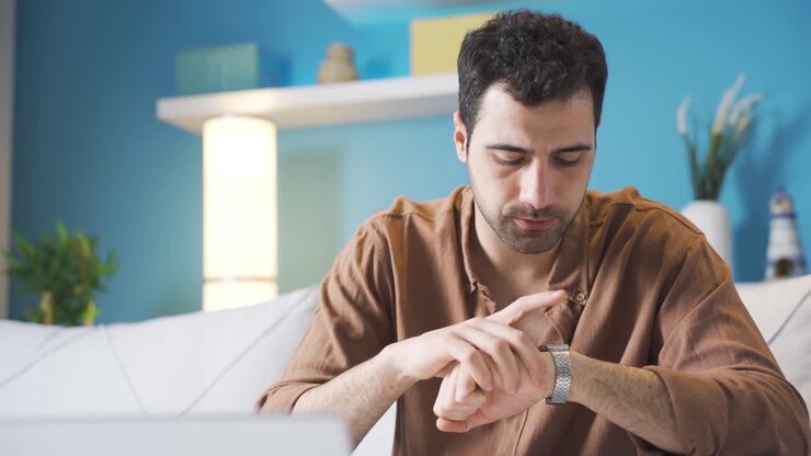 Stressed young man with Time pressure on him.