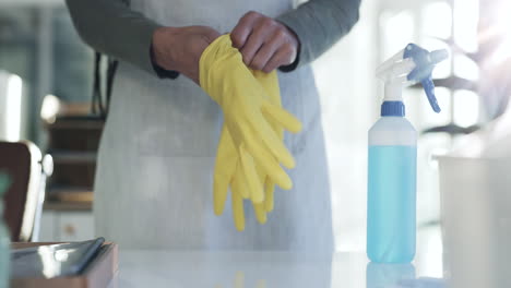 person, hands and gloves in housekeeping