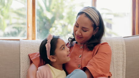 love, mother and daughter on sofa