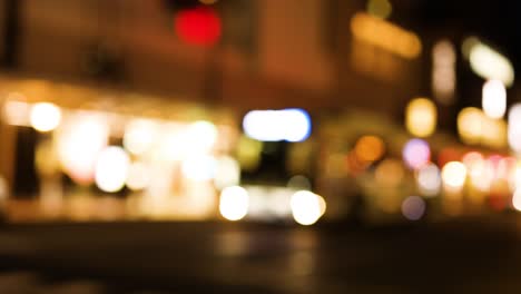 blurred cityscape with glowing lights at night