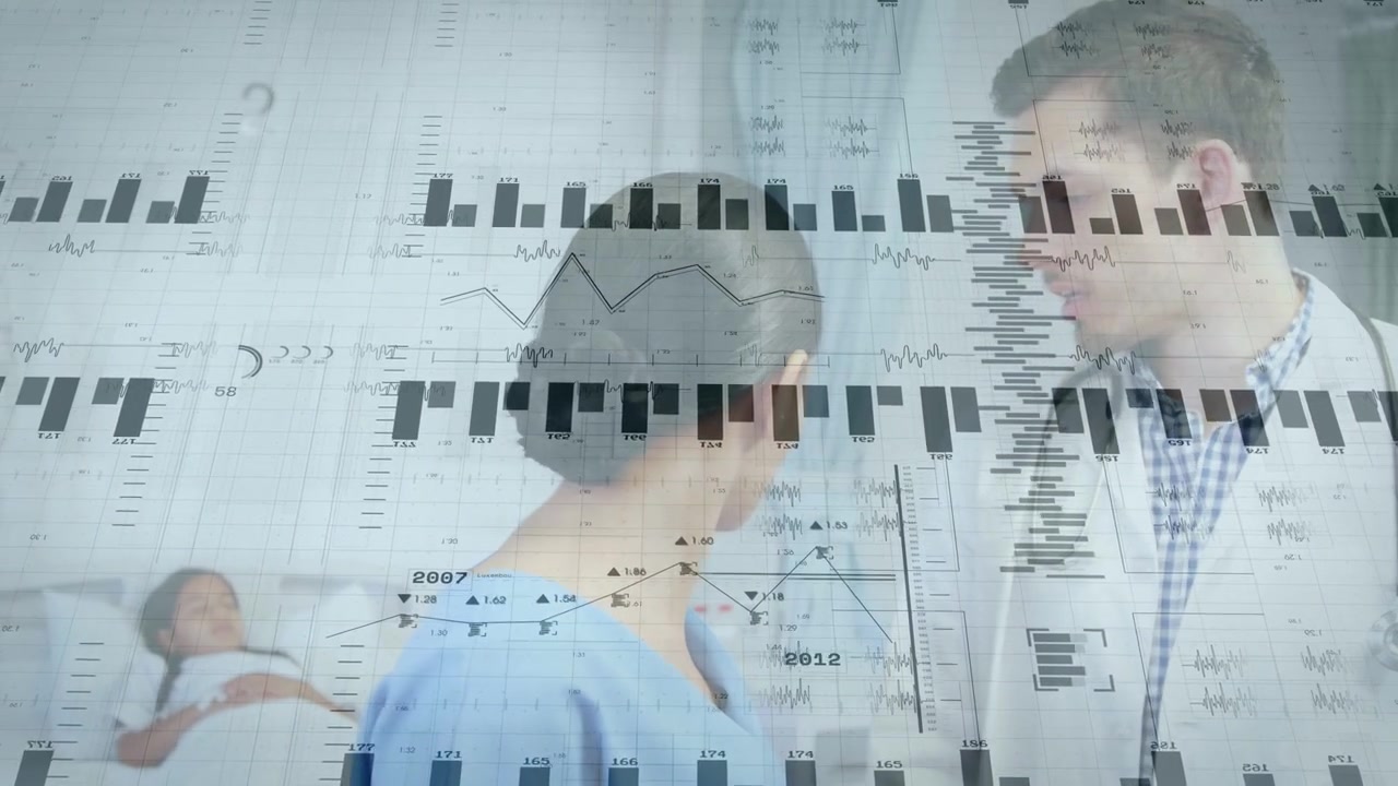 Nurse and doctor recording pediatric vitals on tablet on data graphs appearing and overlaying bed