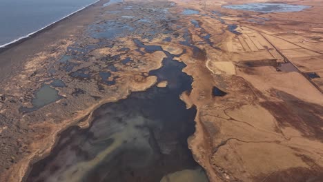 drone aerial view of þjórsá river delta in iceland, stunning wetlands, winding waterways and vast coastal landscapes.