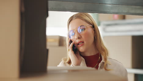woman on the phone in a warehouse