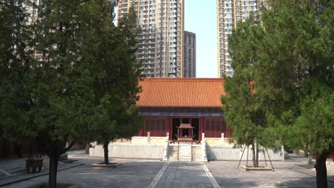 confucian temple building, ancient china with modern building blocks in the background