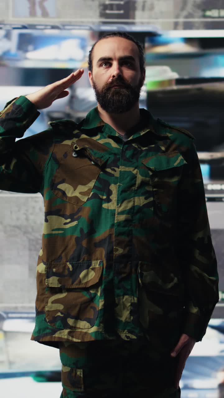 Vertical Video Army officer executes the respectful military salute in command center
