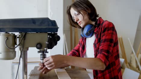 Carpenter tightening drill beat in vertical drill machine 4k