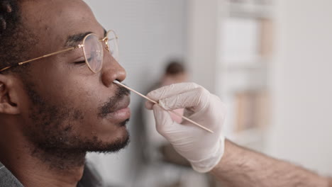 taking test sample from nostril