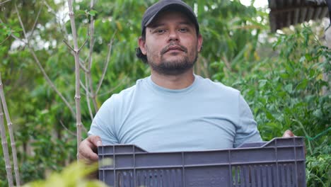 latin american farmer holding harvest basket, sustainability and food security